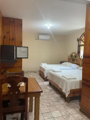 Cama o camas de una habitación en Hotel Paraiso del Pescador