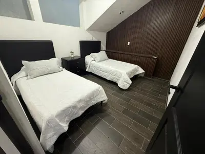 Cama o camas de una habitación en Suite La Lomita #2 climatizada