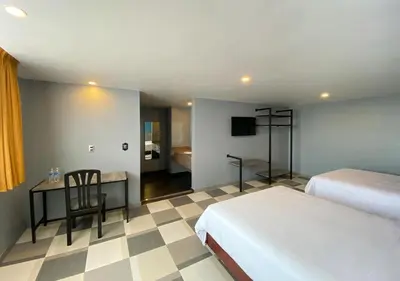 Cama o camas de una habitación en Hotel Estrella de Oriente