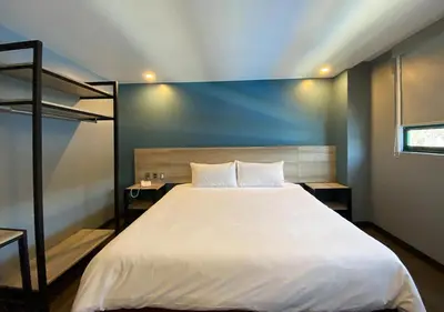 Cama o camas de una habitación en Hotel Estrella de Oriente