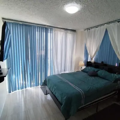 Cama o camas de una habitación en Departamento en Condominio Rocasol