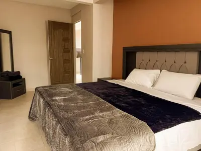 Cama o camas de una habitación en Depa III con vista al centro, a min de Santo Domingo
