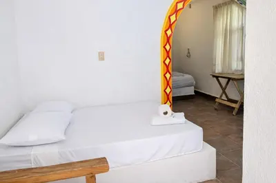 Cama o camas de una habitación en Kaia Beach Hotel