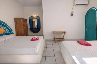 Cama o camas de una habitación en Kaia Beach Hotel