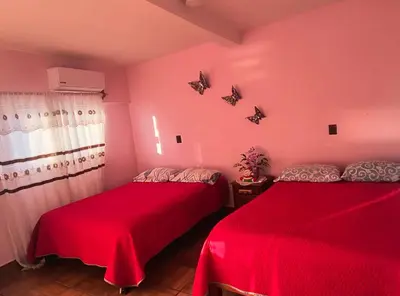 Cama o camas de una habitación en Hotel Ricarda Yopes