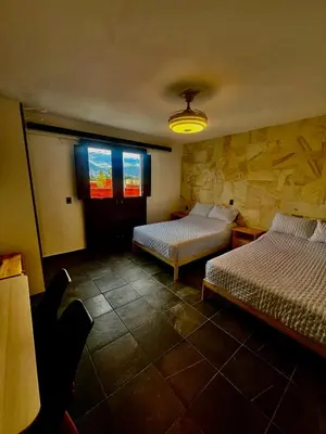 Cama o camas de una habitación en LA ESTANCIA, Casa EA Oaxaca, Centro Histórico, Balcón a las Montañas