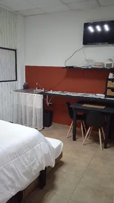 Una televisión o centro de entretenimiento en Hyperrent habitaciones