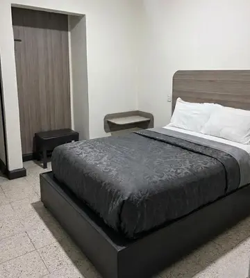 Cama o camas de una habitación en Hotel Descanso