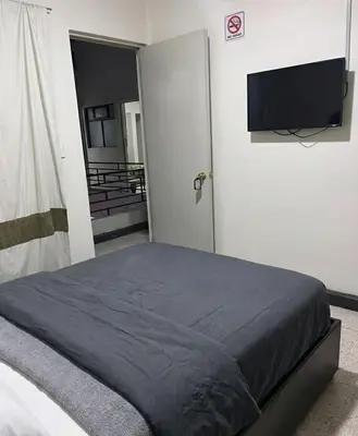 Cama o camas de una habitación en Hotel Descanso