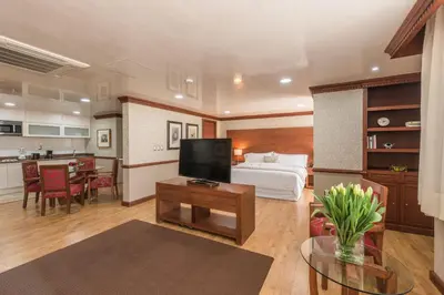 Una cocina o zona de cocina en Suites Perisur Apartamentos Amueblados