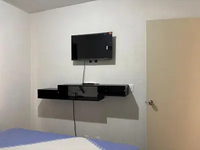 Una televisión o centro de entretenimiento en Casa punta mar Acapulco