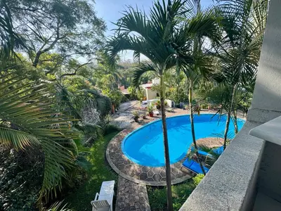 Piscina en o cerca de Casa con Alberca y terraza un lugar tranquilo para disfrutar