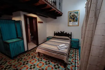 Cama o camas de una habitación en Hotel Posada Casa de la Tía