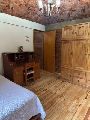 Cama o camas de una habitación en Casa Rústica del pedregal