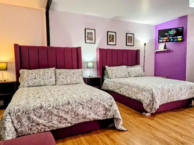 Cama o camas de una habitación en Suite morada Moderna y céntrica ideal hasta para 7 viajeros