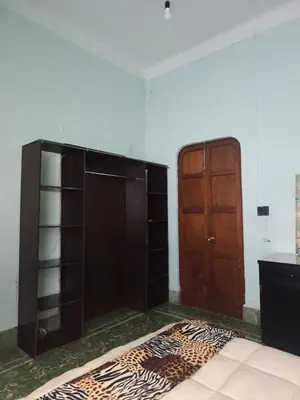 Cama o camas de una habitación en Hospedaje en habitación casa colonial centro histórico Puebla