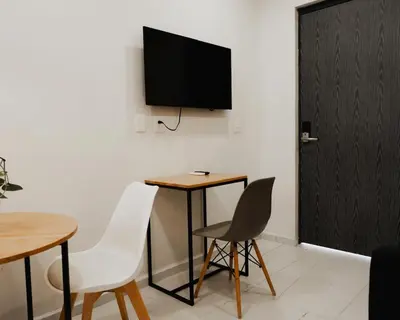 Una televisión o centro de entretenimiento en Departamento Tulipanes - Vista increíble de la CD