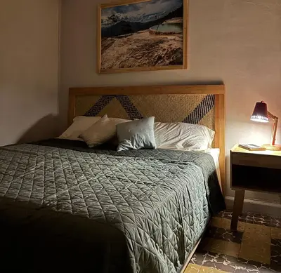 Cama o camas de una habitación en Fresia habitación privada con encanto oaxaqueño