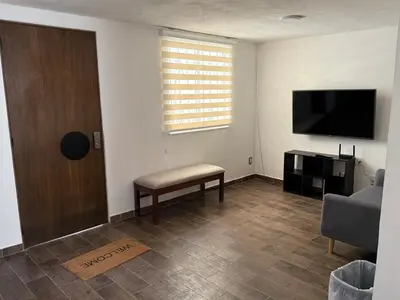 Una televisión o centro de entretenimiento en Casa Cholula