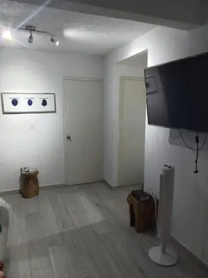 Una televisión o centro de entretenimiento en Depto LUX-A&A con terraza privada