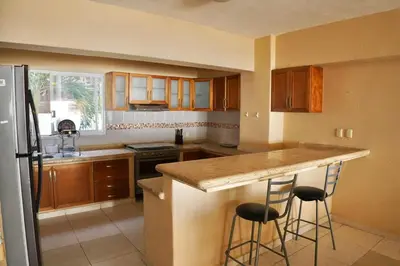Una cocina o zona de cocina en Rincon Frente al mar