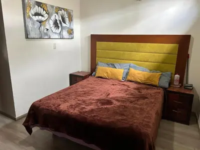 Cama o camas de una habitación en La Esperanza Family Inn