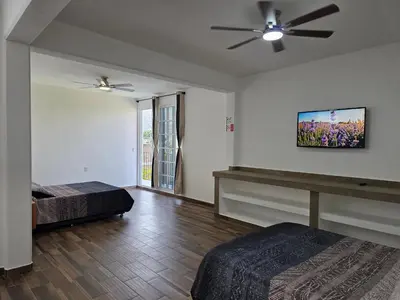 Cama o camas de una habitación en La Casa Blanca VIP