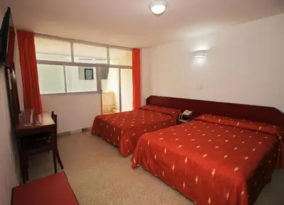 Cama o camas de una habitación en Hotel Royalty