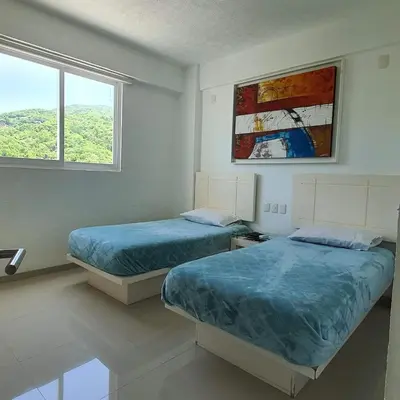 Cama o camas de una habitación en Departamento Fair View Tower Costa Azul, Acapulco