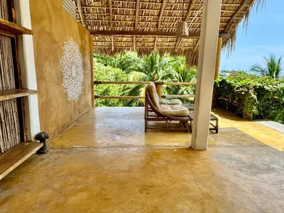 Un balcón o terraza de CASA CON AIRE ACONDICIONADO, PLAYA San Agustinillo Area
