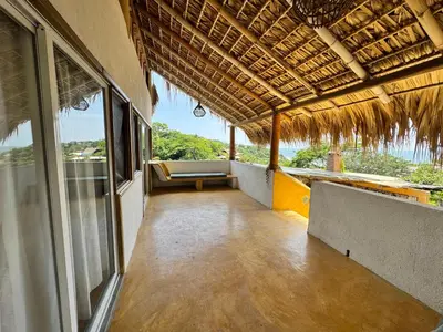 Un balcón o terraza de CASA CON AIRE ACONDICIONADO, PLAYA San Agustinillo Area