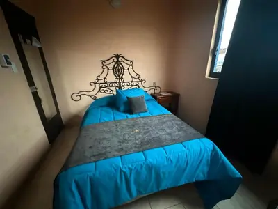 Cama o camas de una habitación en Hotel Los Reyes