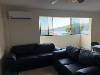 Zona de estar de Apartamento con vista hermosa y playa caleta