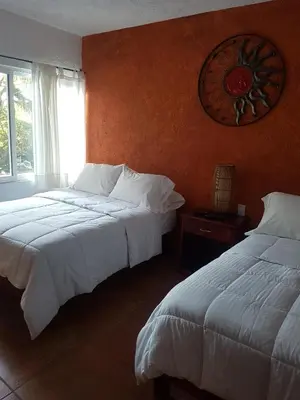 Cama o camas de una habitación en hotel quinta real las palmas malinalco