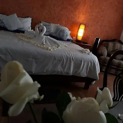 Cama o camas de una habitación en hotel quinta real las palmas malinalco