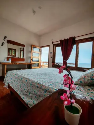 Cama o camas de una habitación en Huatunalco Beach Hotel