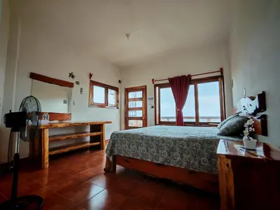 Cama o camas de una habitación en Huatunalco Beach Hotel