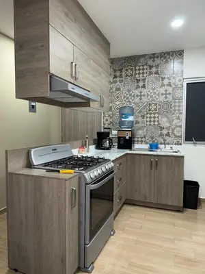 Una cocina o zona de cocina en Departamento Oasis