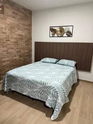 Cama o camas de una habitación en Departamento Oasis