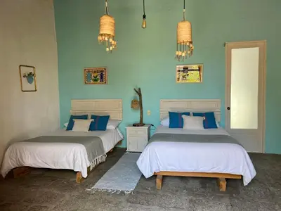 Cama o camas de una habitación en Hacienda Santa Barbara Casa Malinche