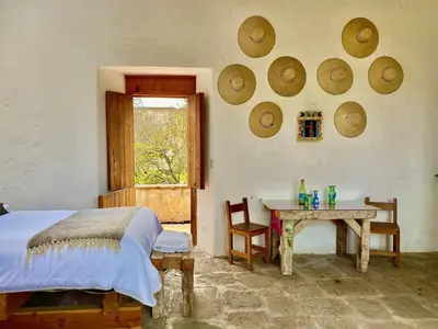 Cama o camas de una habitación en Hacienda Santa Barbara Casa Malinche