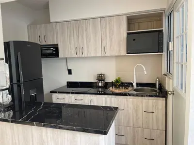 Una cocina o zona de cocina en Alojamiento Elegante