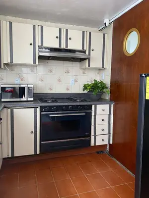 Una cocina o zona de cocina en Habitaciones estadios maravillas