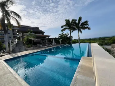 Piscina en o cerca de Condominio Saman Tu Oasis de Tranquilidad