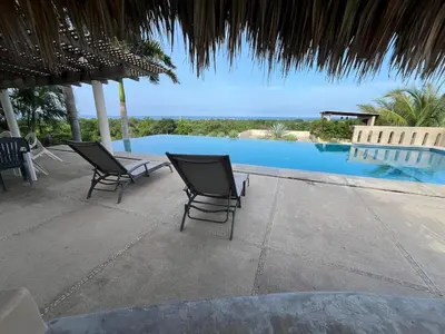Piscina en o cerca de Condominio Saman Tu Oasis de Tranquilidad