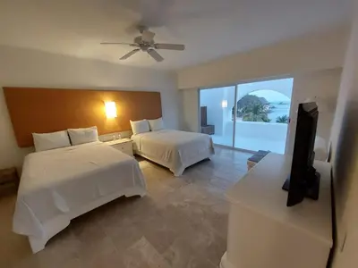 Cama o camas de una habitación en Lovely Beachfront Apartment-Camino Real Zaachila