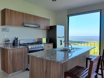 Una cocina o zona de cocina en Depa Isla del Amor con alberca, y acceso al río y la playa