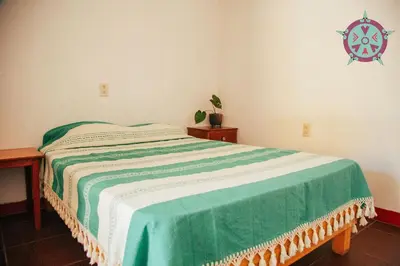 Cama o camas de una habitación en Casa Lua Oaxaca: Comfort y Cultura