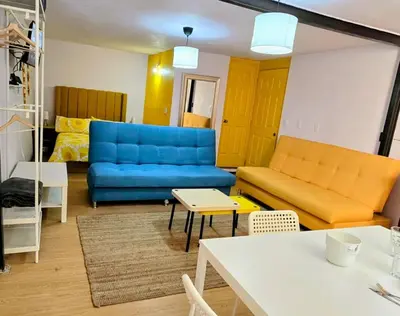 Zona de estar de Suite Amarilla Amplia, Iluminada Hasta 6 viajeros