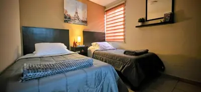Cama o camas de una habitación en Pintoresca y Acogedora Casita Pueblo Mágico